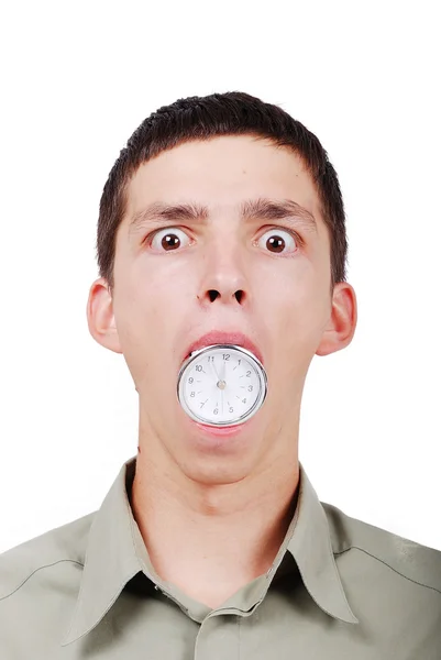 Νεαρός άνδρας με ένα ρολόι στο στόμα του — Φωτογραφία Αρχείου
