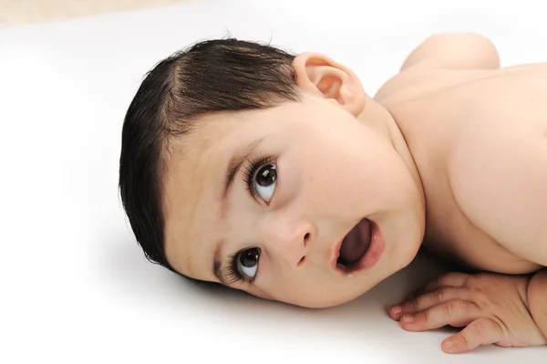 Meztelen aranyos baba elszigetelt fehér background — Stock Fotó