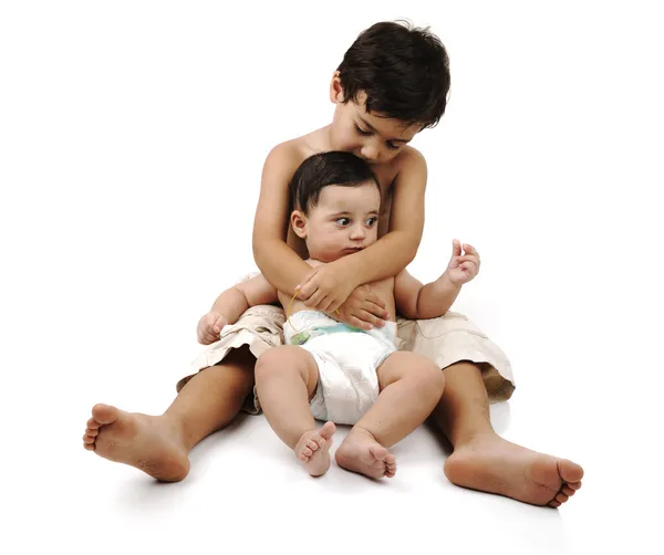 Little kid taking care of his little brother — Stock Photo, Image