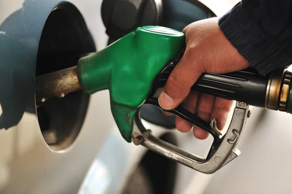 Man refilling the car with fuel on a filling station — Stock Photo, Image