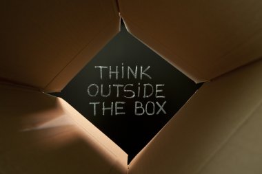 Think outside the box on blackboard clipart