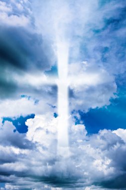 Cross in the cloudy sky clipart