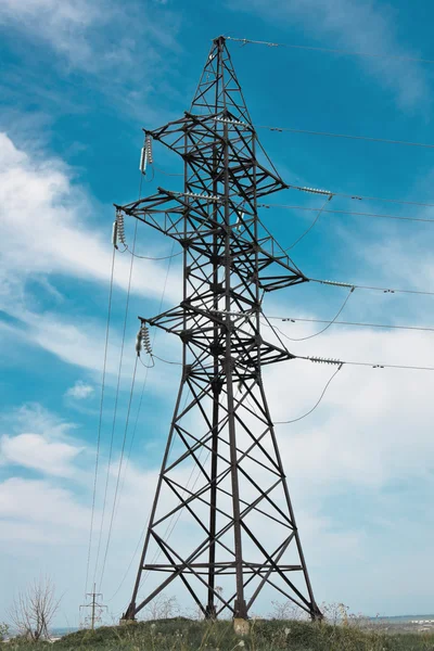 stock image High voltage lines and cloudy sky