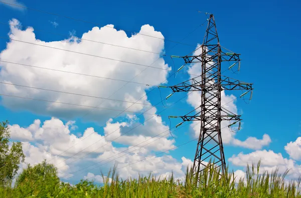 High voltage lines and blue cloudy sky — Stock Photo, Image