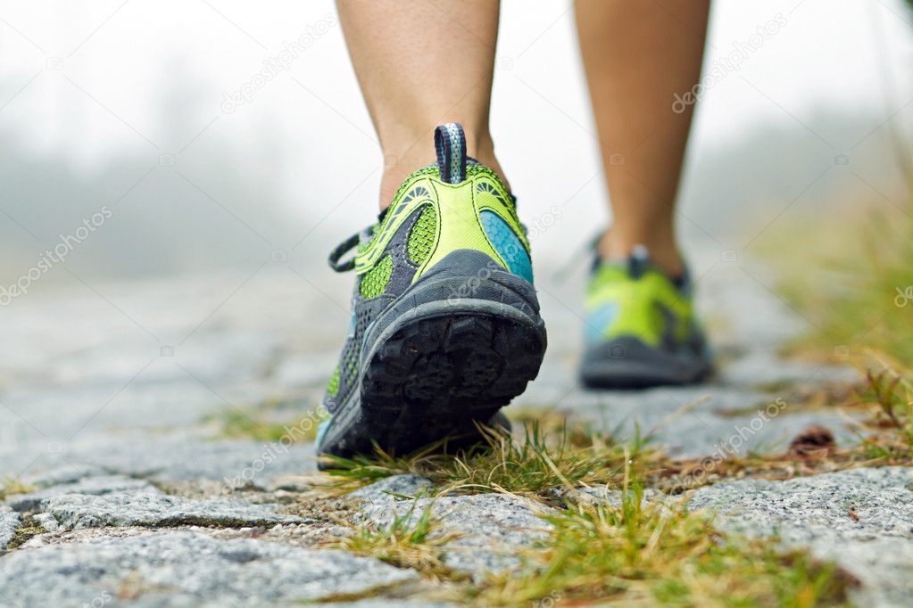 Walking exercise, sport shoes and legs
