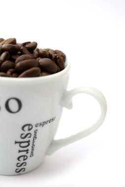 Coffee beans in a cup clipart