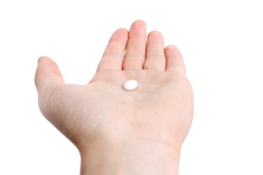 A white pill in the hand clipart