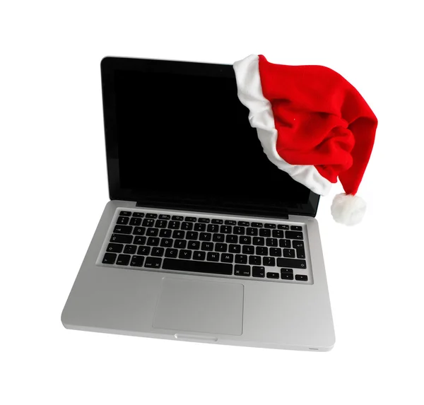 Computer mit Weihnachtsmütze — Stockfoto