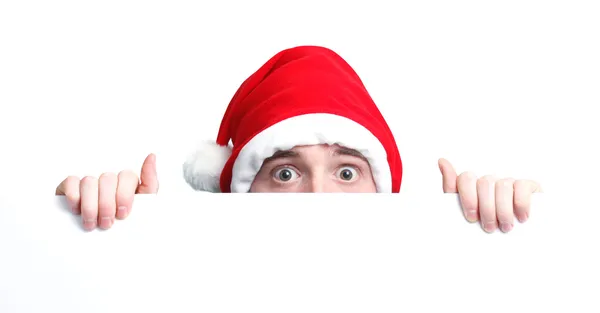 Santa şapka ve işareti adam — Stok fotoğraf