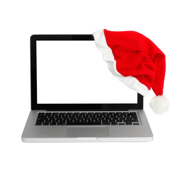 Computer mit Weihnachtsmütze — Stockfoto