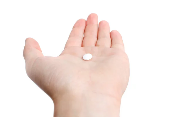 Una píldora blanca en la mano —  Fotos de Stock
