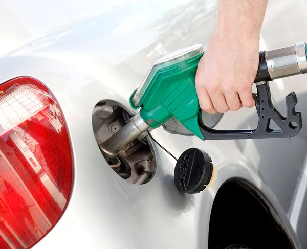 A man pumping gas in to the tank — Stock Photo, Image