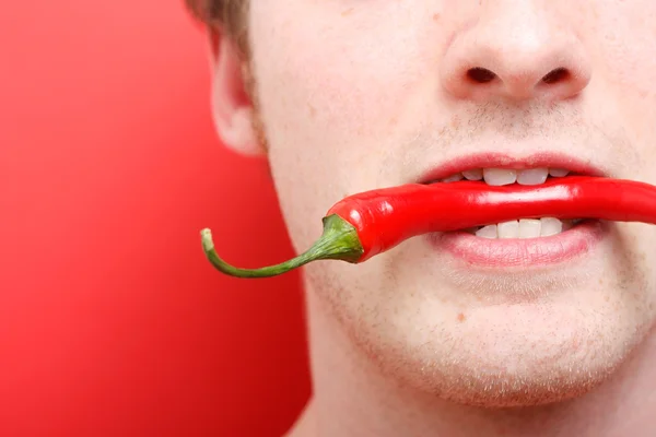 stock image Eating chili pepper