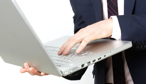 Homem de negócios com laptop digitação — Fotografia de Stock