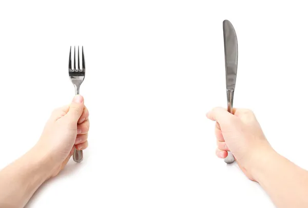 Händer med kniv och gaffel — Stockfoto