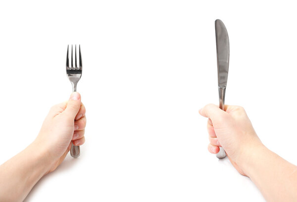 Hands holding knife and fork
