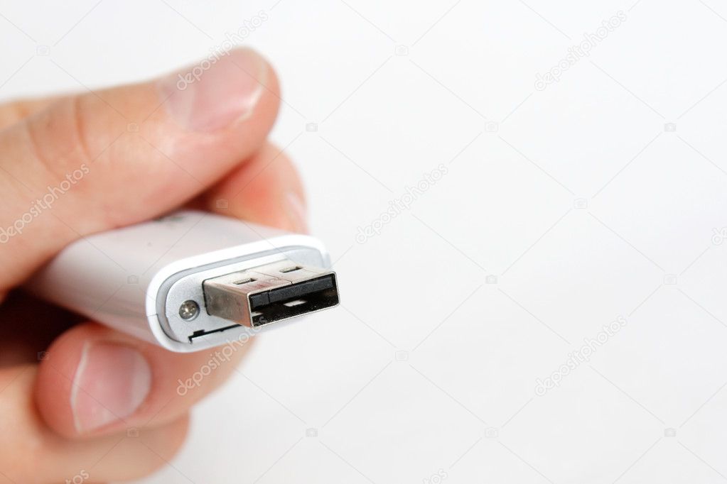 Senior holding a USB drive