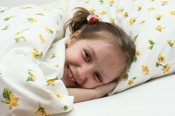 Child girl at the bed — Stock Photo, Image