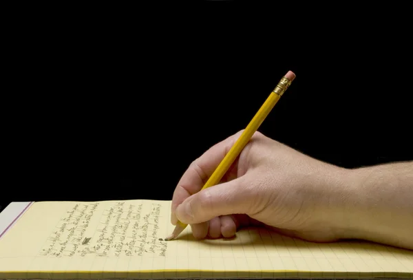 Écriture manuscrite avec pointe de crayon cassée sur papier jaune — Photo