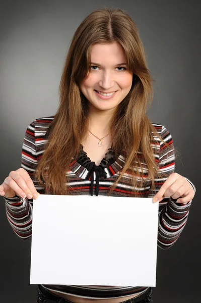 Young woman holding empty white board — Stock Photo, Image