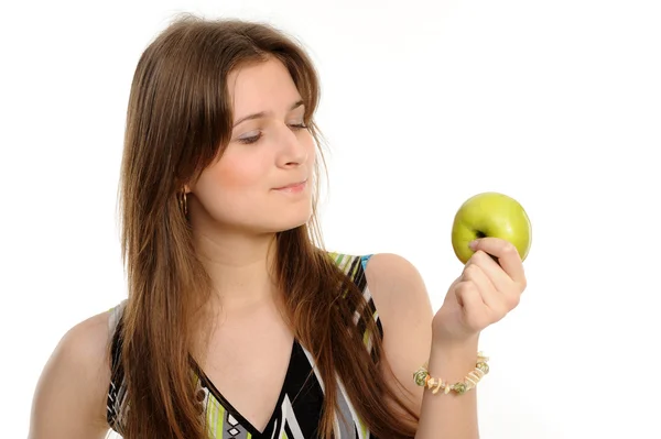 Woman holding a green apple thinks — Stock Photo, Image