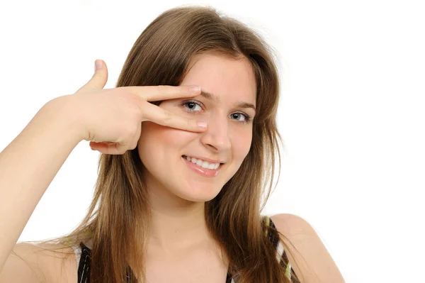 Woman holding up fingers and peeking between them — Stock Photo, Image