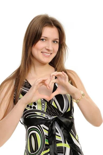 Jeune fille montrant "coeur" avec ses doigts . — Photo