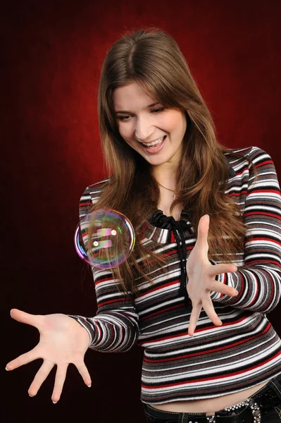 Young girl catch soap bubbles — Stock Photo, Image