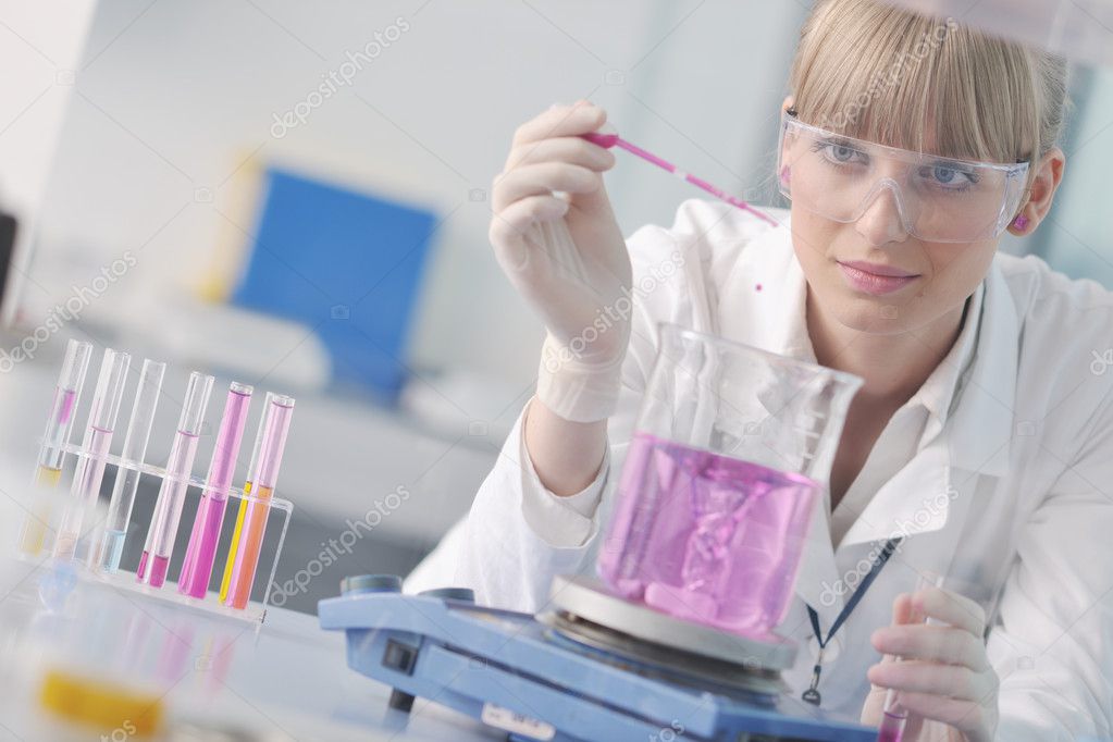 http://static6.depositphotos.com/1003697/546/i/950/depositphotos_5464960-Female-researcher-holding-up-a-test-tube-in-lab.jpg