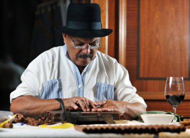 Man making luxury handmade cuban cigare clipart