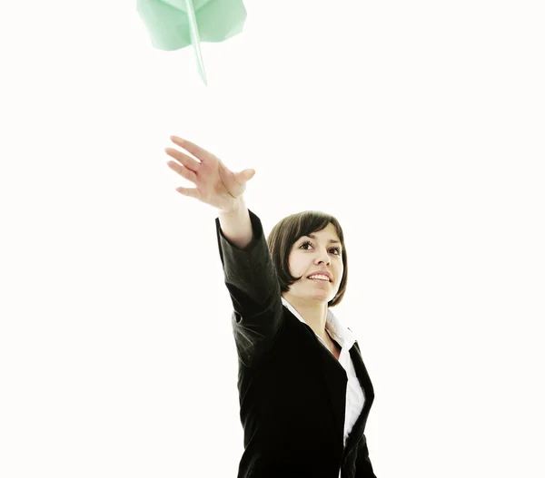 Mulher de negócios jogando avião de papel — Fotografia de Stock