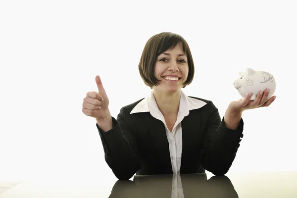 Business woman putting coins money in piggy bank — Stock Photo, Image