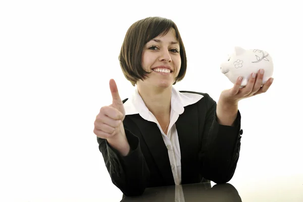 Mulher de negócios colocando moedas em dinheiro porquinho banco — Fotografia de Stock