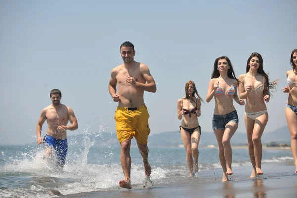 Happy group have fun and running on beach — Stock Photo, Image