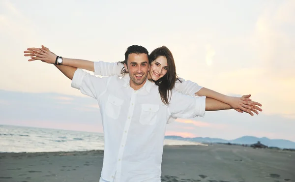 Happy young couple have fun on beach — Stock Photo, Image