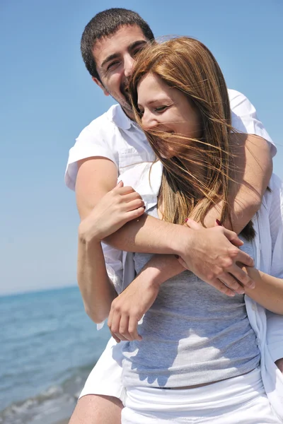Happy young couple have fun on beach Royalty Free Stock Images