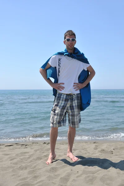 Funny superhero standing on beach — Stock Photo, Image