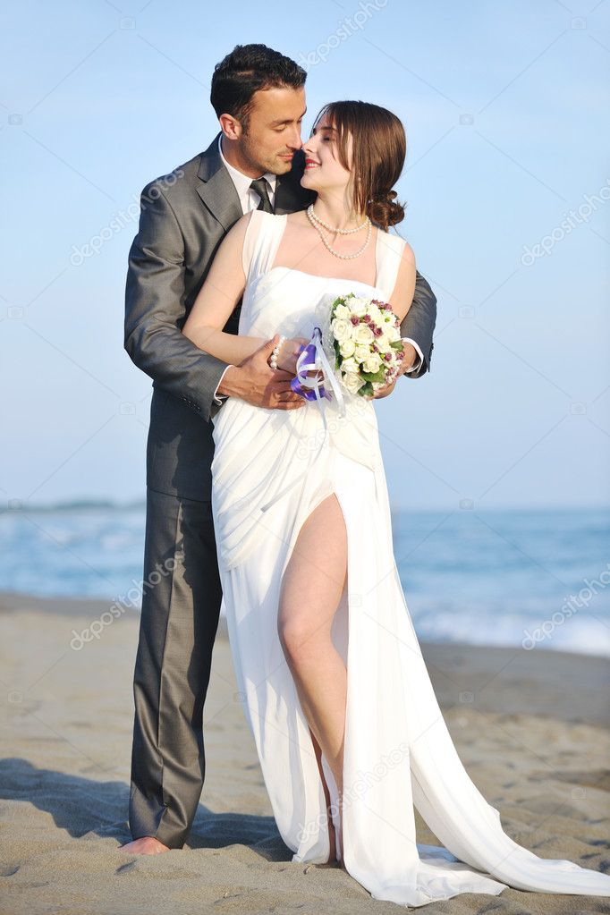 Romantic beach wedding at sunset