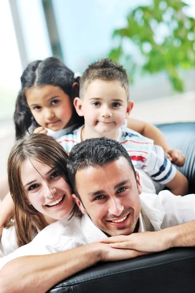 Happy young family have fun and working on laptop at home — Stock Photo, Image
