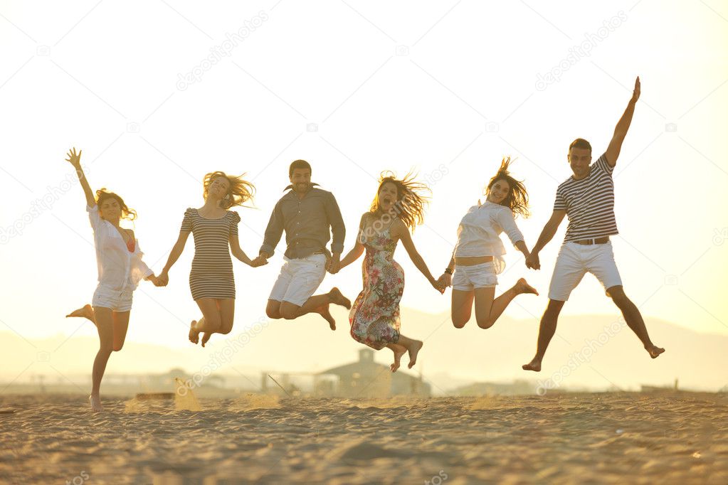 Happy young group have fun on beach