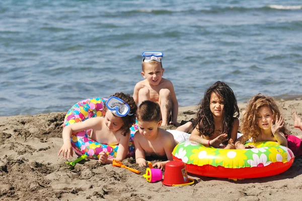 Child group have fun and play with beach toys — Stock Photo, Image