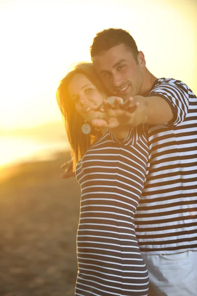 Happy young couple have romantic time on beach — Stock Photo, Image
