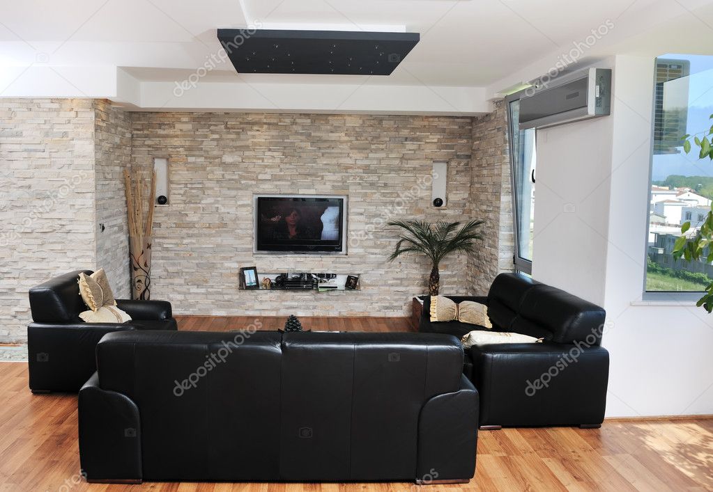 Интерьер гостиной с телевизором на стене фото