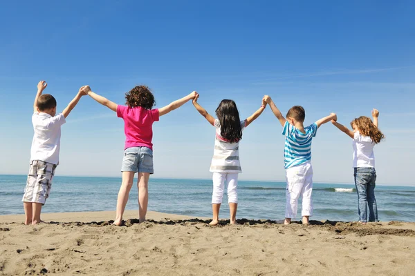 stock image Happy child group playing on beach