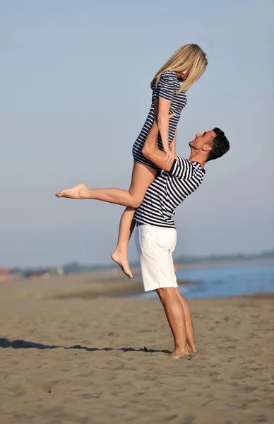 Happy young couple have fun on beach — Stock Photo, Image