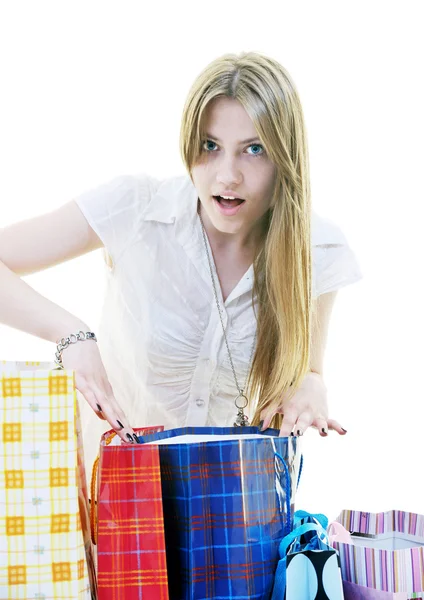 Happy young adult women shopping with colored bags — Stock Photo, Image