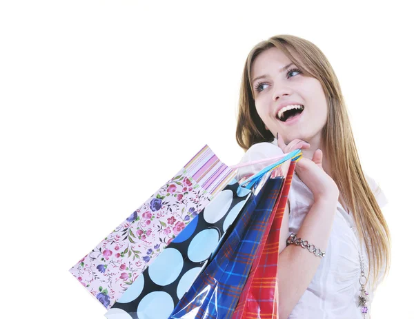 Happy young adult women shopping with colored bags — Stock Photo, Image