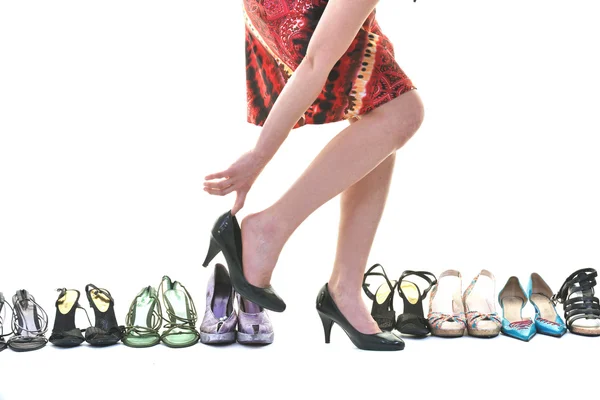Mooie jonge vrouw met het kopen van schoenen verslaving, geïsoleerd op whit — Stockfoto