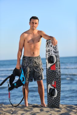 sunset beach adlı bir genç kitsurf adam portresi