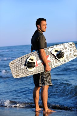 sunset beach adlı bir genç kitsurf adam portresi